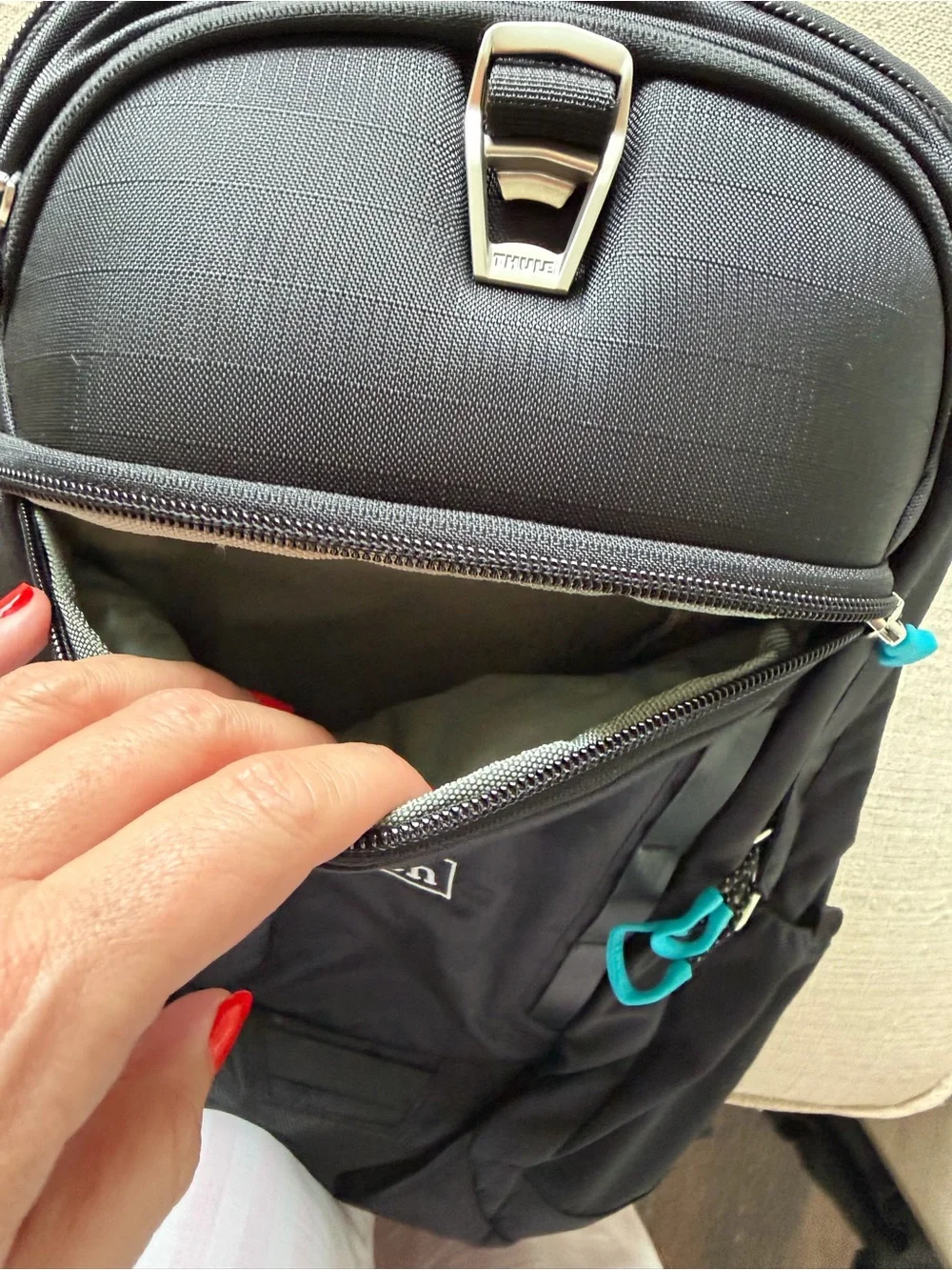Thule Black Backpack with Aqua Zipper Pulls - Hilton Logo